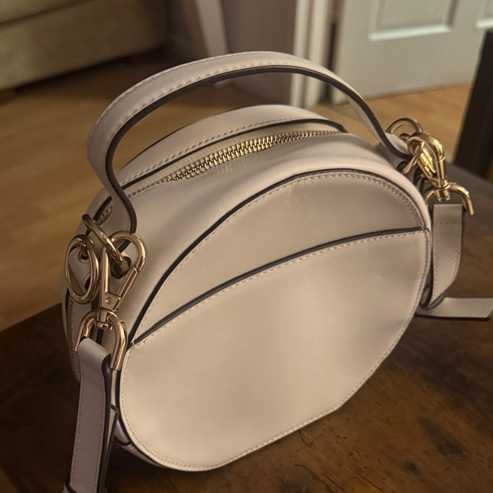 Michael Kors Ivory Round Crossbody Bag with Gold Accents - Picture 2 of 4